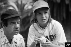 Actor Walter Matthau, left, was famous for playing grumpy old men in several films, including his turn as baseball coach Morris Buttermaker in the 1976 film The Bad News Bears.