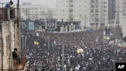 Hundreds of thousands of ultra-Orthodox Jews rally in a massive show of force against plans to force them to serve in the Israeli military, blocking roads and paralyzing the city of Jerusalem, March 2, 2014.