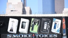 In this file photo taken on September 17, 2019 A sign advertises Juul vaping products in Los Angeles, California, September 17, 2019.