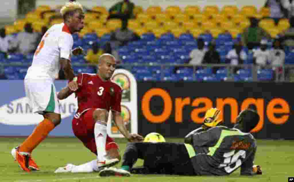 Morocco's Badr El Kaddouri (3) challenges Niger's goalkeeper Kassaly Daouda (16) during their final African Cup of Nations Group C soccer match at the Stade De L'Amitie Stadium in Libreville, Gabon January 31, 2012.