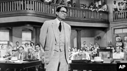 FILE - Gregory Peck as attorney Atticus Finch, a small-town Southern lawyer who defends a black man accused of rape, in a scene from the 1962 movie "To Kill a Mockingbird." 