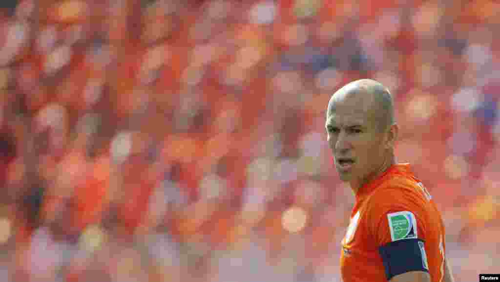 Arjen Robben of the Netherlands against the backdrop of a sea of Netherlands fans during the match against Chile at the Corinthians arena in Sao Paulo, June 23, 2014.