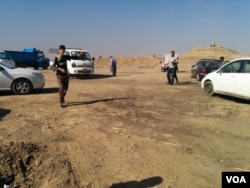 Locals say that despite the dangers and the fact that they are finding little left of use, they feel the need to see their homes again, in Kazir province of Kurdistan in Iraq, Oct. 22, 2016. (H. Murdock/VOA)