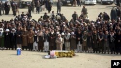 Afghans pray during the funeral of a victim who was killed in Saturday's deadly suicide attack in Kabul, Afghanistan, Jan. 28, 2018. 