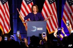 House Minority Leader Nancy Pelosi of Calif., smiles as she is cheered by a crowd of Democratic supporters during an election night returns event at the Hyatt Regency Hotel, on Tuesday, Nov. 6, 2018, in Washington.