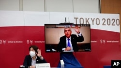 Quan chức Nhật và Ủy ban Olympics Quốc tế tại cuộc họp hôm 8/7.