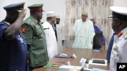 Nigerian President Muhammadu Buhari presides at a meeting with his nation's service chiefs in Abuja, June 2, 2015. 