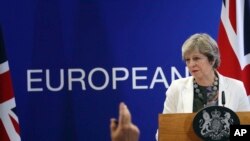 British Prime Minister Theresa May speaks during a media conference at an EU summit in Brussels, Oct. 20, 2017. European Union leaders gathered Friday to weigh progress in negotiations on Britain's departure.