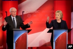 Democratic presidential candidate Senator Bernie Sanders and former Secretary of State Hillary Clinton spar during a presidential primary debate at the University of New Hampshire in Durham, Feb. 4, 2016.