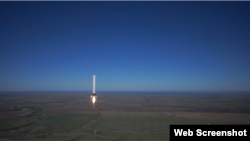 SpaceX's Grasshopper reusable rocket is seen flying over McGregor, Texas. 