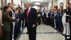 FILE - President Donald Trump greets military personnel during his visit to the Pentagon, July 20, 2017. (AP Photo/Pablo Martinez Monsivais)