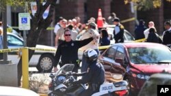 Emergency workers gather at the scene of a shooting involving Democratic Representative Gabrielle Giffords of Arizona at a Safeway grocery store in Tucson, Democrat, 8 Jan 2010