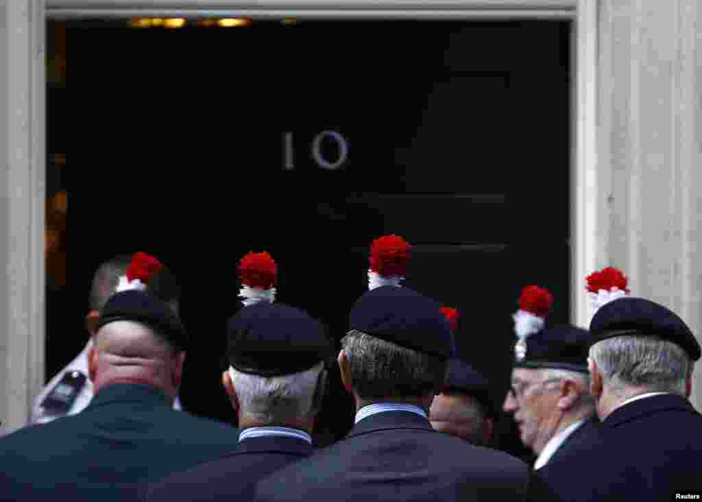 Veterans of the Royal Regiment of Fusiliers 2nd Battalion hand in a petition protesting against the regiment's disbandment at 10 Downing Street in central London. The Royal Regiment of Fusiliers has been disbanded in recent cuts to the defense budget.
