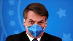 Brazil's President Jair Bolsonaro is pictured with his protective face mask at a press statement during the coronavirus disease (COVID-19) outbreak in Brasilia, Brazil, March 20, 2020. Picture taken March 20, 2020. (REUTERS/Ueslei Marcelino)