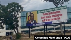 A poster is seen in Harare of President Emmerson Mnangangwa, Nov. 2, 2021, thanking those in Zimbabwe who have been vaccinated and urging others to do so as well. (Columbus Mavhunga/VOA)