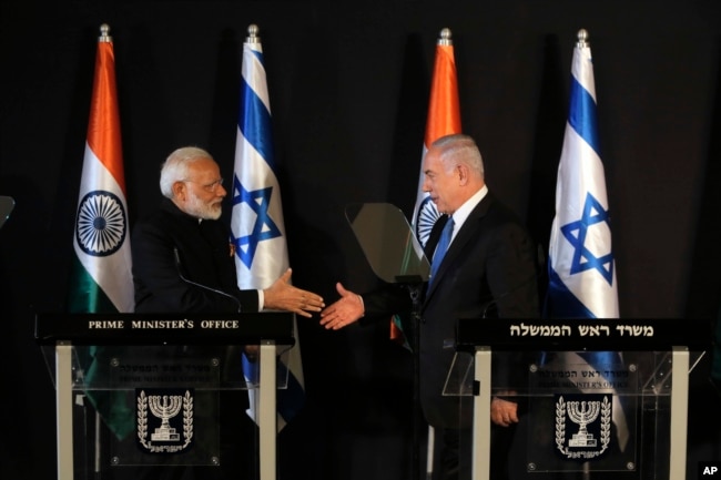 Indian Prime Minister Narendra Modi, left, shakes hands with Israeli Prime Minister Benjamin Netanyahu during their meeting at the King David hotel in Jerusalem, July 5, 2017.