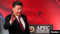 FILE- President of China Xi Jinping arrives for the APEC CEO Summit 2018 at Port Moresby, Papua New Guinea, Nov. 17, 2018.