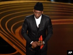 Mahershala Ali accepts the award for best performance by an actor in a supporting role for "Green Book" at the Oscars on Sunday, Feb. 24, 2019, at the Dolby Theatre in Los Angeles.
