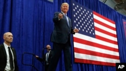 Republican presidential candidate Donald Trump arrives to speak at a campaign rally, Friday, Oct. 21, 2016, in Newtown, Pa.