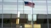 FILE - This file photo taken on May 05, 2016 shows an office worker sitting at his desk at a bank in Washington, DC. Millennials, those who reached adulthood around the year 2000, want to work a less rigid schedule, which could mean the end of the fixed 40-hour work week.