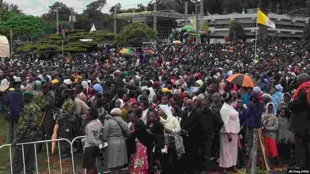 People gather to attend a Mass celebrated by Pope Francis, at the campus of the University of Nairobi, Kenya, Nov. 26, 2015. 