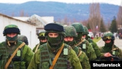 Russian military forces, referred to as "Little Green Men," in Perevalne, Crimea, March 5, 2014.