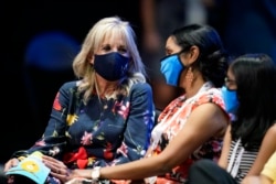 First lady Jill Biden, left, visits with friends and family members of contestants during the finals of the 2021 Scripps National Spelling Bee at Disney World Thursday, July 8, 2021.