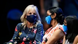 First lady Jill Biden, left, visits with friends and family members of contestants during the finals of the 2021 Scripps National Spelling Bee at Disney World Thursday, July 8, 2021.