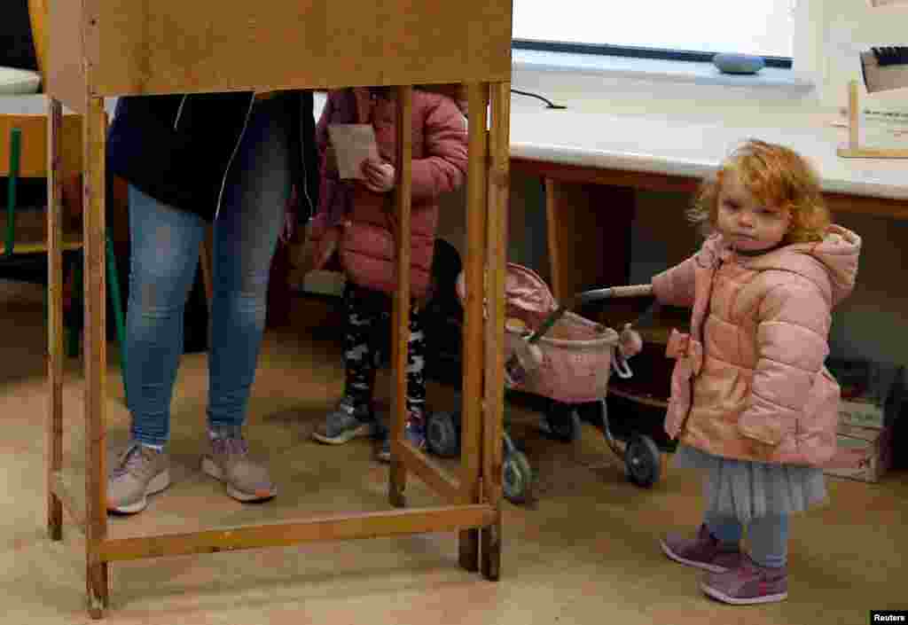 A young girl is seen at a polling station in Inisheer (Inis Oirr), ahead of Ireland&#39;s national election, Ireland.