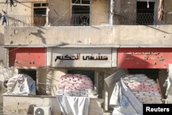 Sandbags are stacked on the entrances of damaged al-Hakeem hospital, in the rebel-held besieged area of Aleppo, Syria, Nov. 19, 2016.