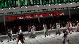 FILE - In this Feb. 25, 2020 file photo, models wear creations for the Dior fashion collection during Women's fashion week Fall/Winter 2020/21 presented in Paris. (AP Photo/Thibault Camus, File)