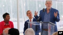 "Star Wars" creator filmmaker George Lucas, right, and his wife Mellody Hobson, left, and Don Bacigalupi, Founding President, center, attend the ceremony of the Lucas Museum of Narrative Art in Los Angeles, March 14, 2018.