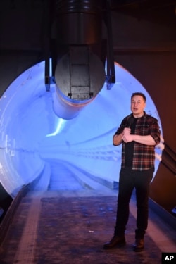 Elon Musk, co-founder and chief executive officer of Tesla Inc., speaks during an unveiling event for the Boring Company Hawthorne test tunnel in California on Dec. 18, 2018. (Robyn Beck/Pool Photo via AP)