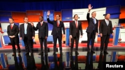 Republican presidential candidates Sen. Rand Paul, Gov. Chris Christie, Dr. Ben Carson, Sen. Ted Cruz, Sen. Marco Rubio, former Gov. Jeb Bush and Gov. John Kasich stand onstage at the start of the Republican presidential debate in Des Moines, Iowa Jan. 28