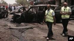 Emergency personnel inspect damage after a bomb attack has targeted Egypt's prosecutor general in the Heliopolis district of Cairo, Egypt, June 29, 2015.