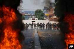 Bolivarian National Guard troops man a barricade blocking access to the Francisco De Paula Santander international bridge in Urena, Venezuela, on the border with Colombia, Feb. 23, 2019.