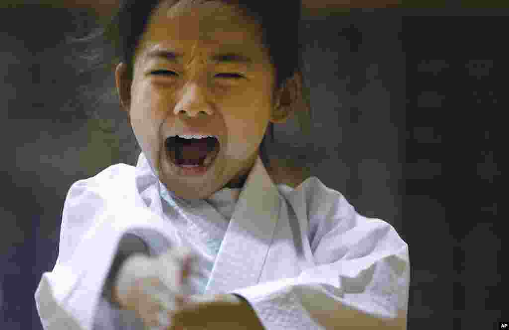 Nine-year-old Mahiro Takano, a three-time Japan karate champion in her age group, practices in Nagaoka, Niigata prefecture, north of Tokyo.