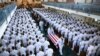 The family follows as the casket of Sen. John McCain, R-Ariz., is moved from the Chapel on the grounds of the United States Navel Academy after a service 