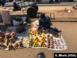 Whoever wins the July 30th elections has to address the problem of unemployment as most Zimbabweans have resorted to informal jobs and vending as in case of this person Harare in this photo, July 28, 2018.