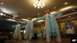 Waitresses not only serve food, they also put on musical performance for the customers in the Pyongyang Restaurant.