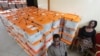 FILE - Polling station workers are seen guarding ballot boxes following presidential elections in Lusaka, Zambia, Jan. 21, 2015.