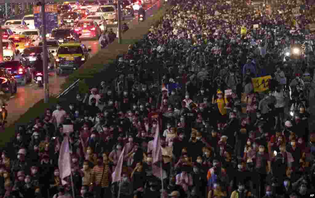 Hundreds of pro-democracy protesters march demanding the release of pro-democracy activists in Bangkok, Thailand.