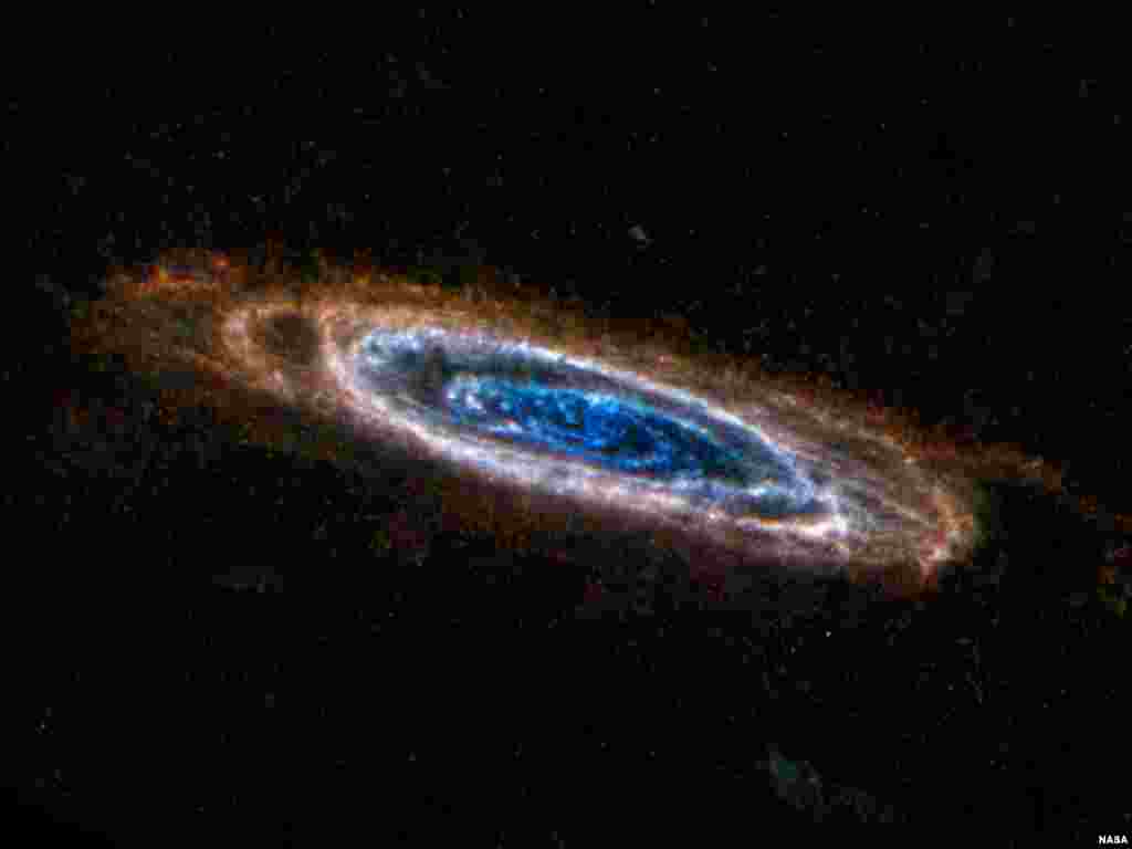 The ring-like swirls of dust filling the Andromeda galaxy stand out colorfully in this new image from the Herschel Space Observatory, a European Space Agency mission that receives important NASA participation. (ESA/NASA/JPL-Caltech/NHSC)