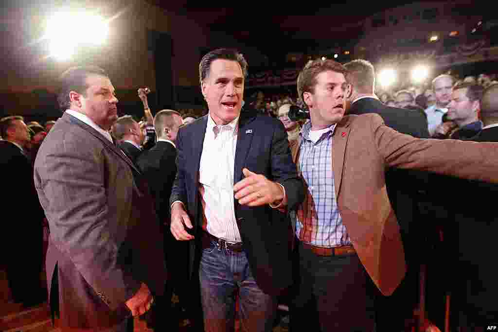 Republican presidential candidate Mitt Romney leaves the stage to greet supporters at a campaign rally at the Royal Oak Theater in Royal Oak, Michigan on February 27, 2012. (AP)