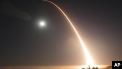 FILE - In this image provided by the U.S. Air Force, an unarmed Minuteman 3 intercontinental ballistic missile is launched during a May 3, 2017, test at Vandenberg Air Force Base, California. 