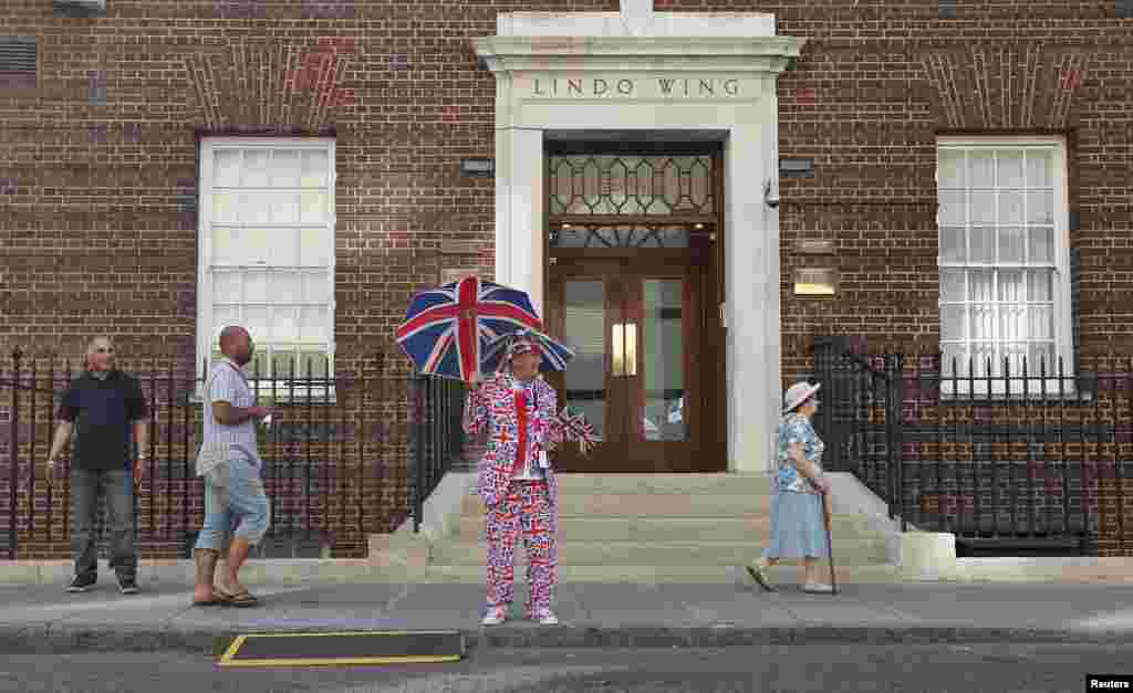 A royal supporter stands outside the Lindo Wing of St Mary's Hospital, where Britain's Catherine, Duchess of Cambridge is due to give birth, in London July 19, 2013.