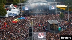 Singer Monschi with his band band "Feine Sahne Fischfilet" perform during an "anti-racism concert" in Chemnitz, Germany, Sept. 3, 2018. 