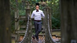 Annie Hobson, director of the Camp Hope, one of the programs Rockford, Ill., is offering not only for kids who are victims, but those who are present when domestic abuse is occurring, poses for a portrait near one of many obstacle course challenges at Atw