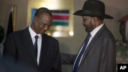 FILE - South Sudan President Salva Kiir (R) who has replaced Riek Machar with Taban Deng Gai (L) as first vice president, is seen at the presidential palace in Juba, South Sudan, July 26, 2016.