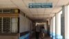 FILE - A patient accompanied by a visitor is seen walking inside Kenyatta National Hospital in Nairobi, Kenya. 